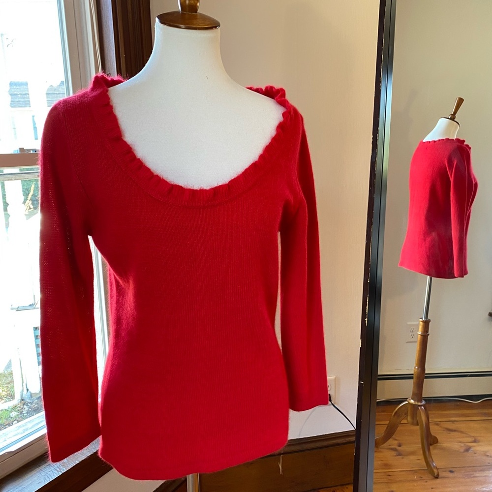 Fuzzy red holiday sweater with low cut scoop neck
